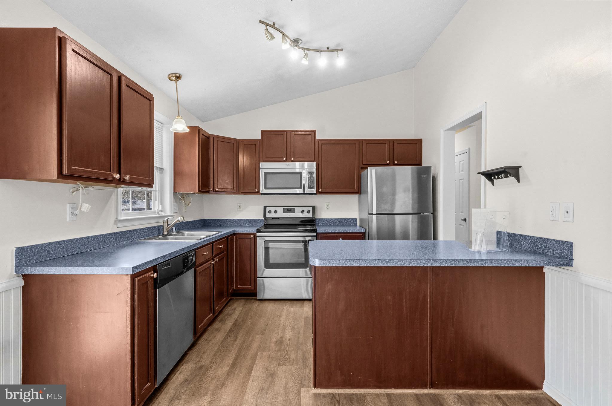 2616 Ruffin Drive Fredericksburg, VA 22408 - Photo 15 of 36 a kitchen with stainless steel appliances granite countertop a stove a sink refrigerator and a microwave oven