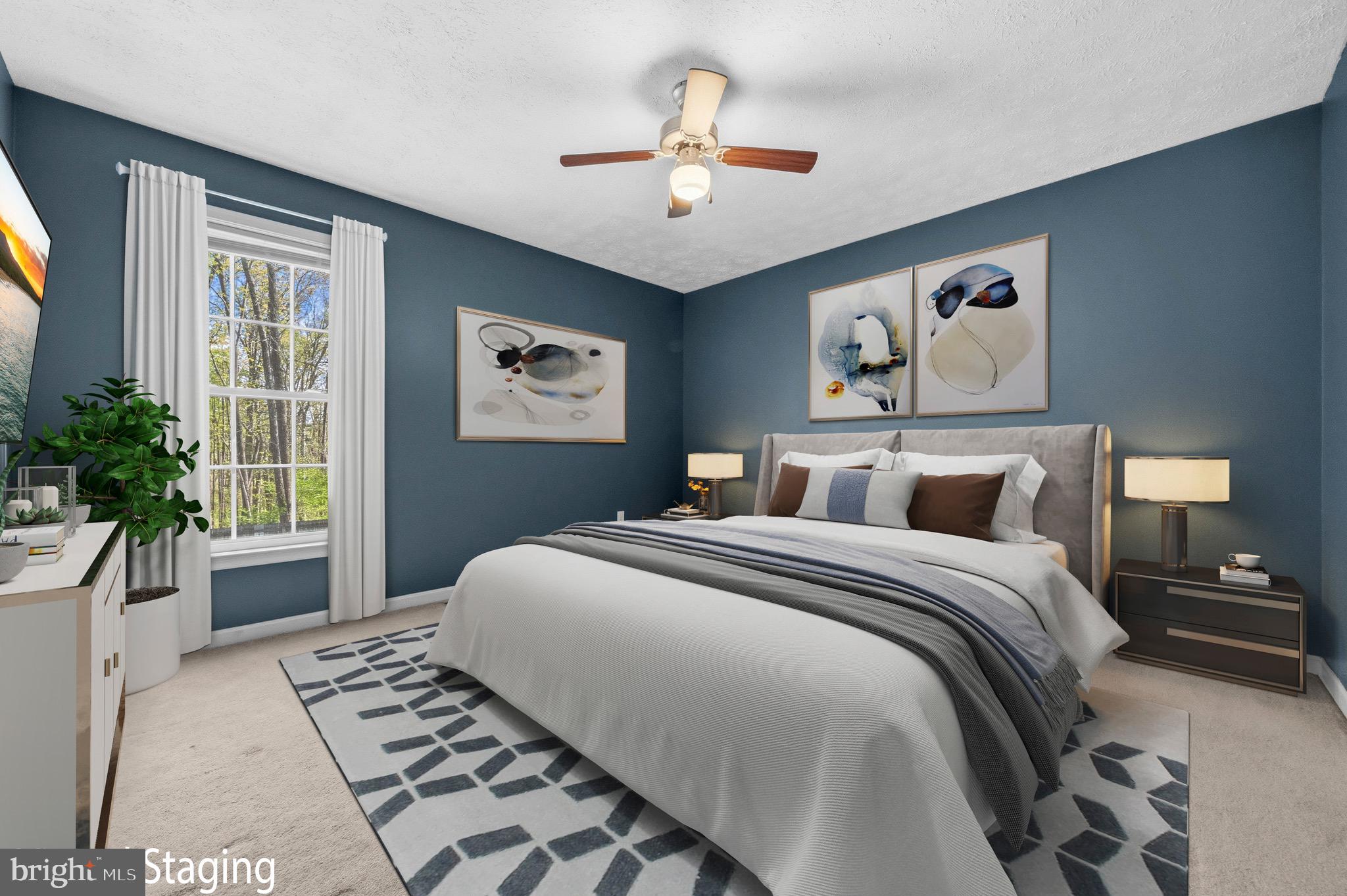 2616 Ruffin Drive Fredericksburg, VA 22408 - Photo 17 of 36 a bedroom with a large bed and a window
