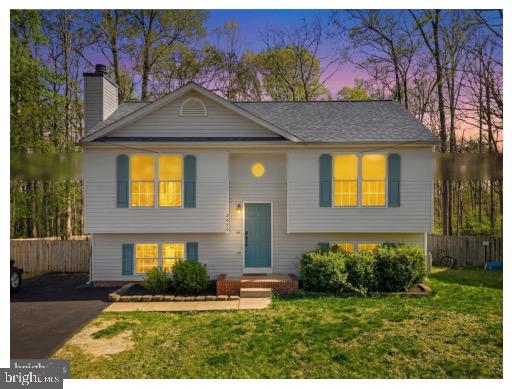 2616 Ruffin Drive Fredericksburg, VA 22408 - Photo 2 of 36 a front view of a house with a yard