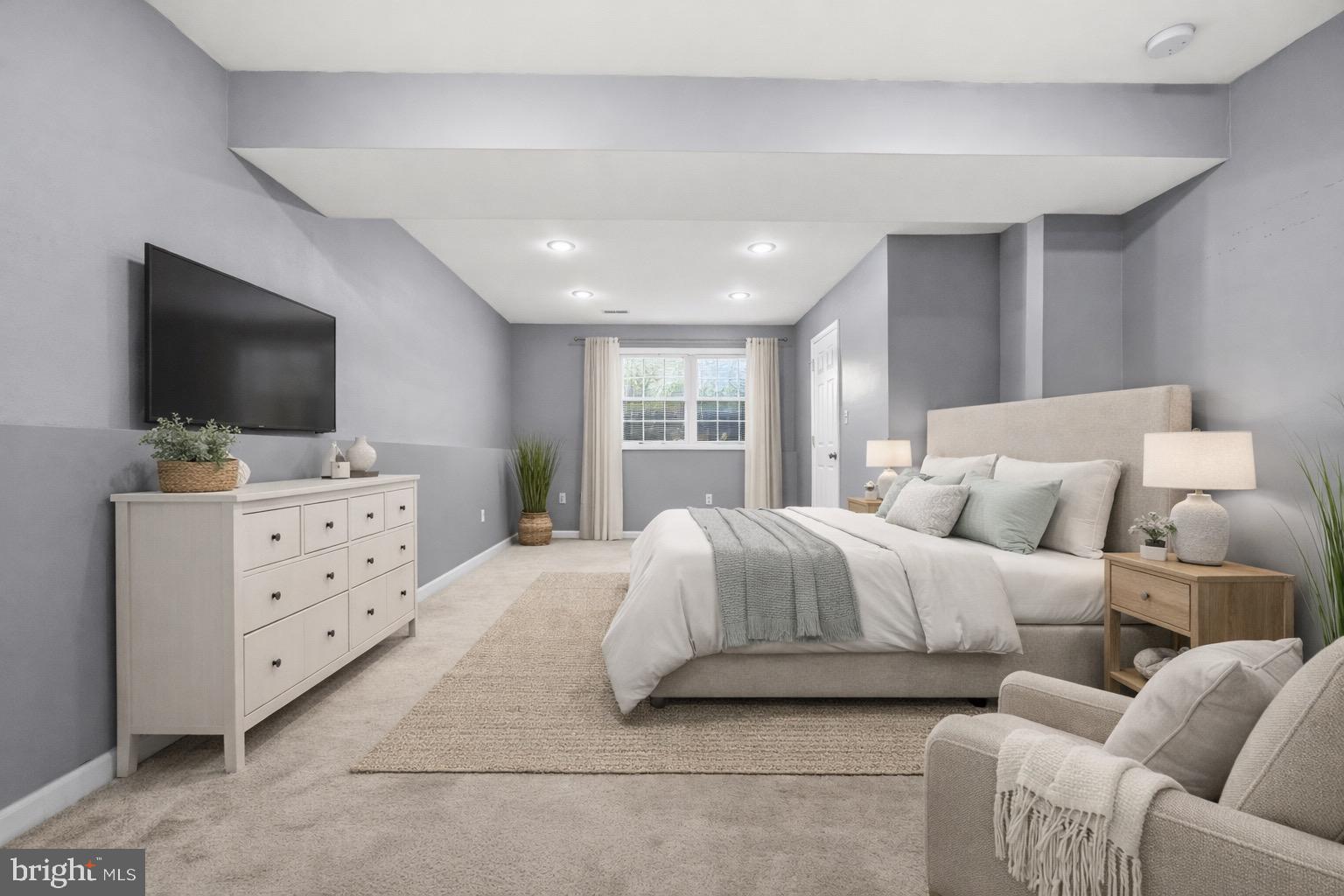 2616 Ruffin Drive Fredericksburg, VA 22408 - Photo 24 of 36 a spacious bedroom with a bed and a flat screen television
