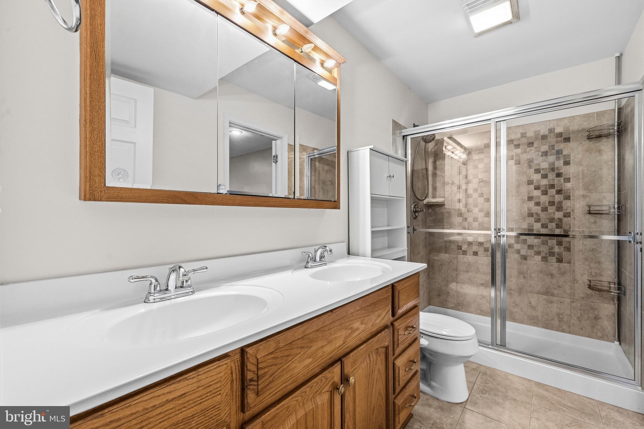 2616 Ruffin Drive Fredericksburg, VA 22408 - Photo 27 of 36 a bathroom with a sink toilet and shower