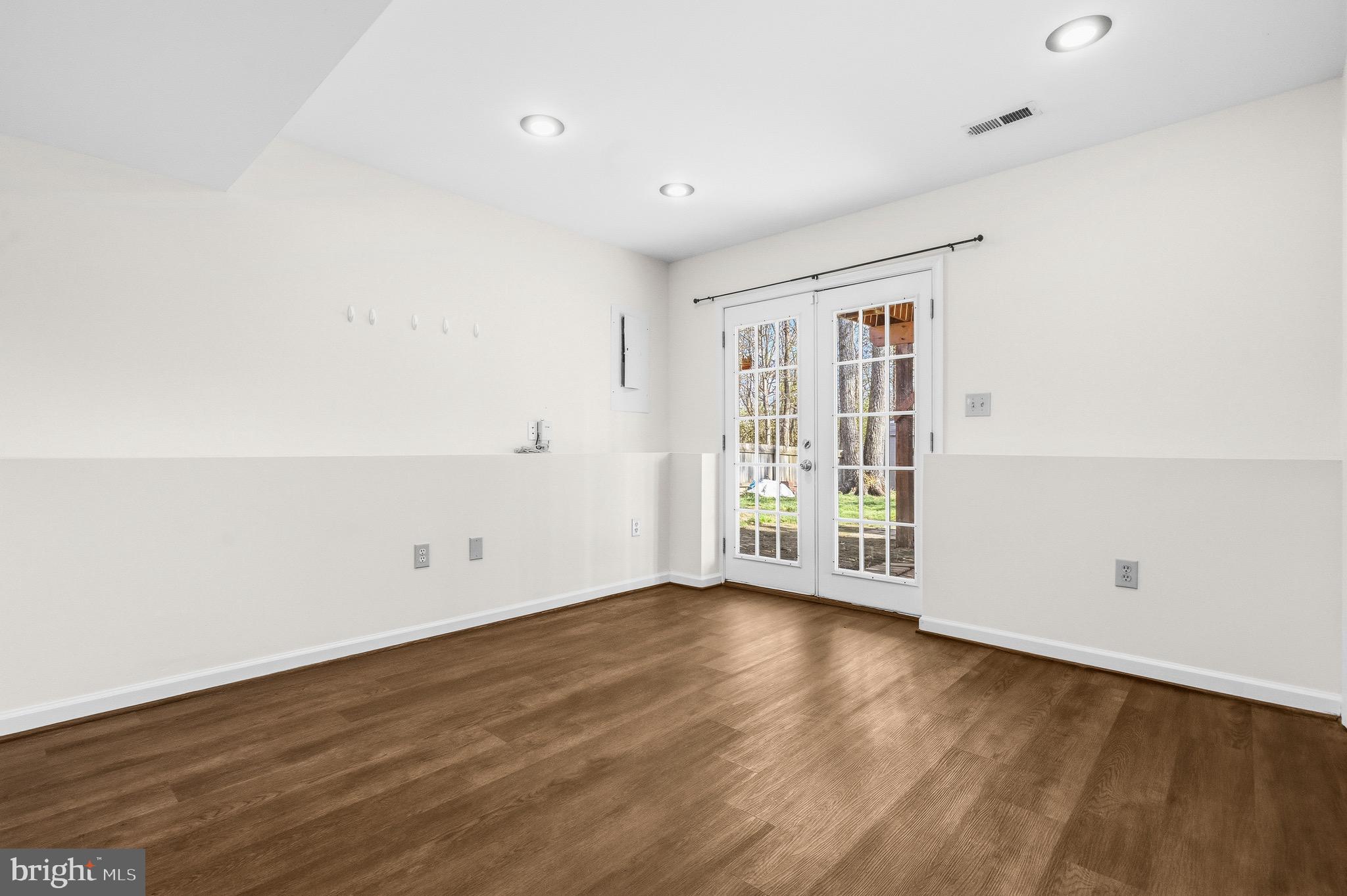 2616 Ruffin Drive Fredericksburg, VA 22408 - Photo 31 of 36 an empty room with wooden floor and windows