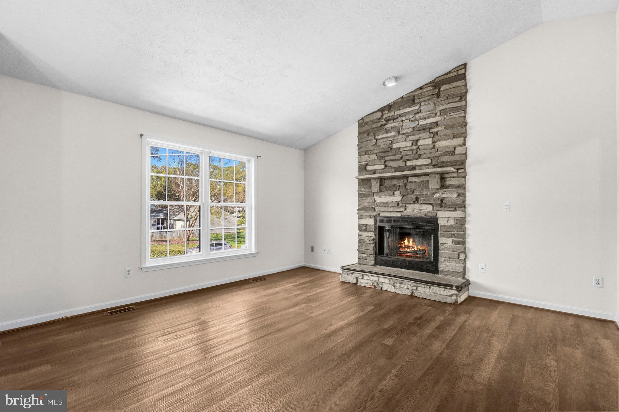 2616 Ruffin Drive Fredericksburg, VA 22408 - Photo 4 of 36 an empty room with a fireplace and window