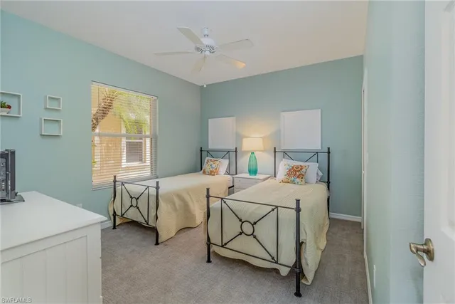 a bed room with a bed and a chandelier