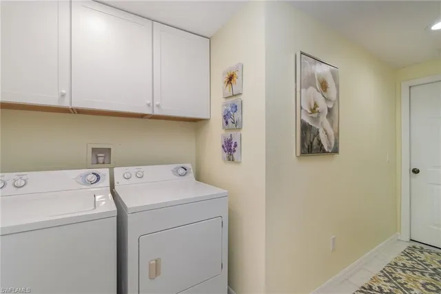 a front view of a house with plants