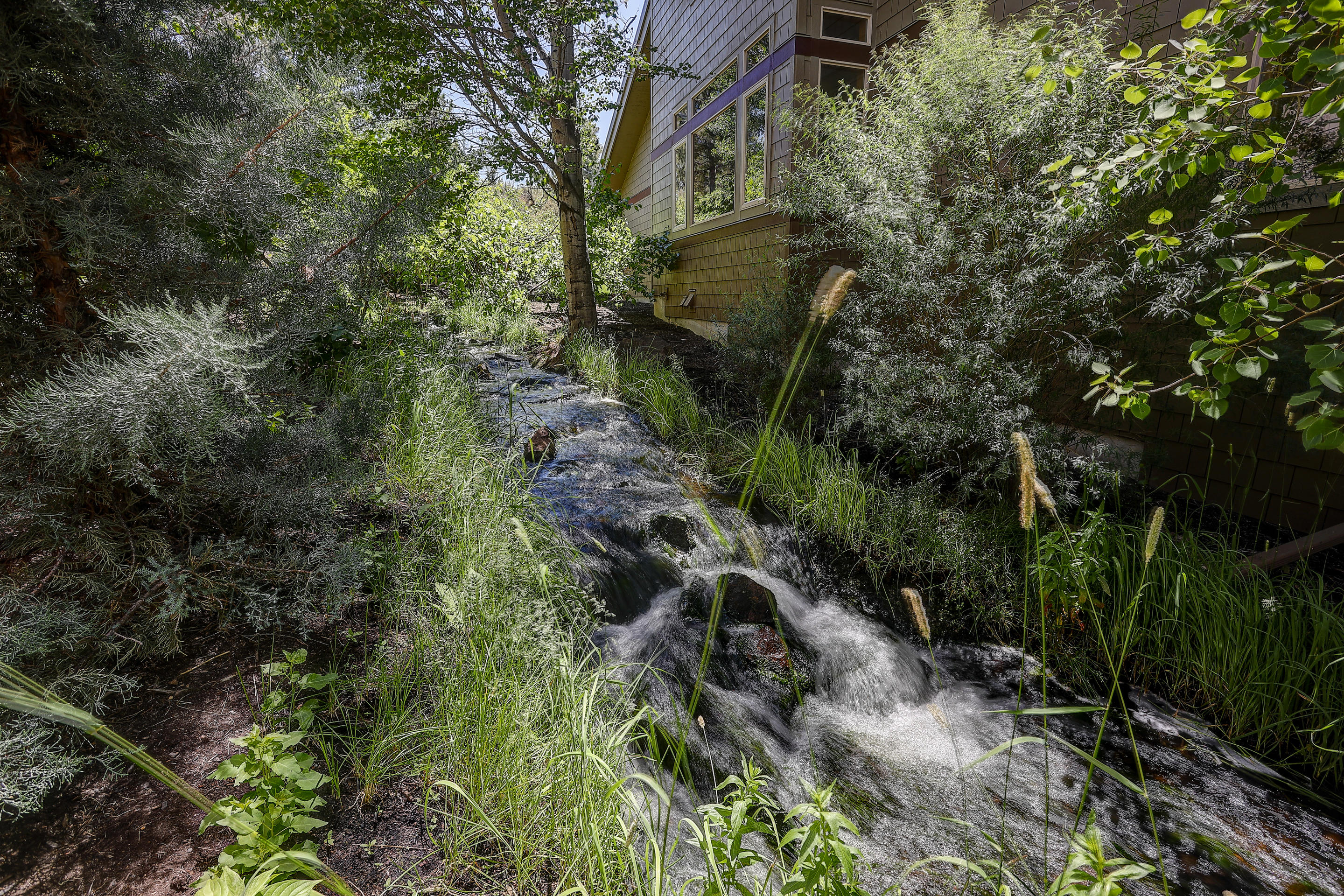 19574 Painted Ridge Loop, Unit 16 Bend, OR 97702 - Photo 35 of 43 Creek running along side of house