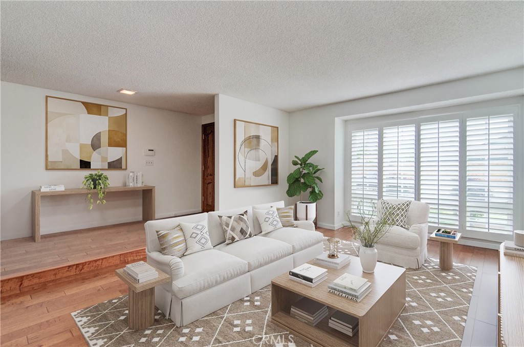 10091 Saltair Drive Cypress, CA 90630 - Photo 2 of 42 a living room with furniture and a large window