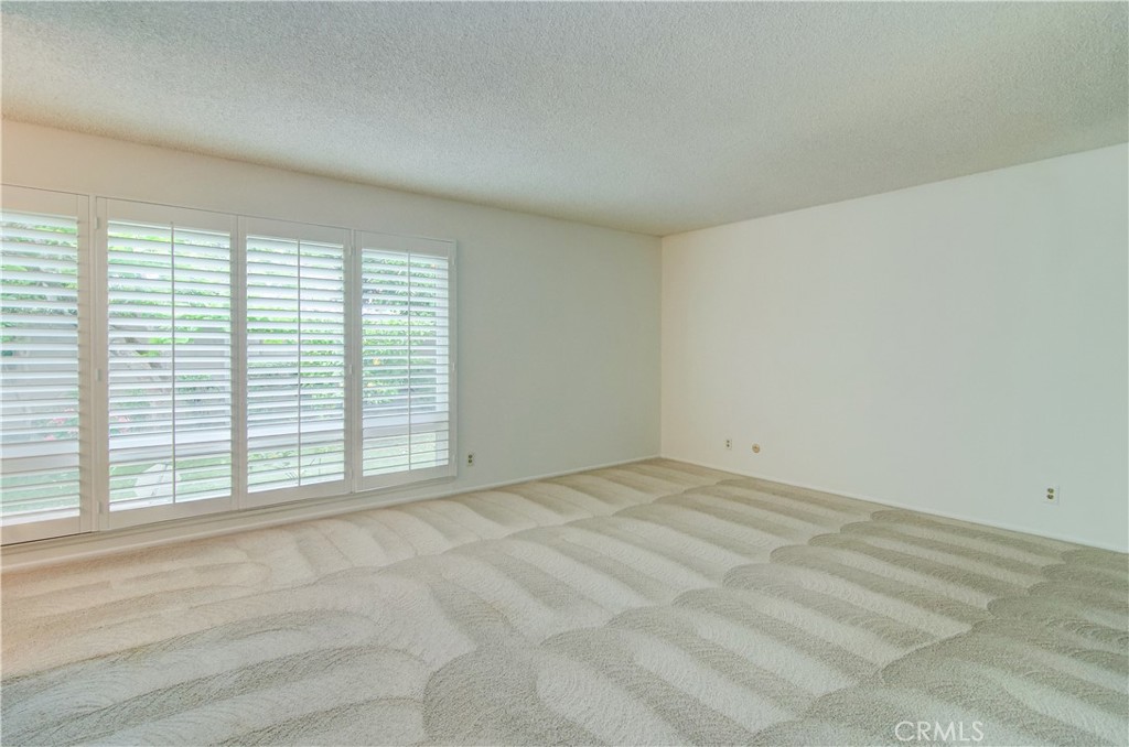10091 Saltair Drive Cypress, CA 90630 - Photo 24 of 42 an empty room with windows