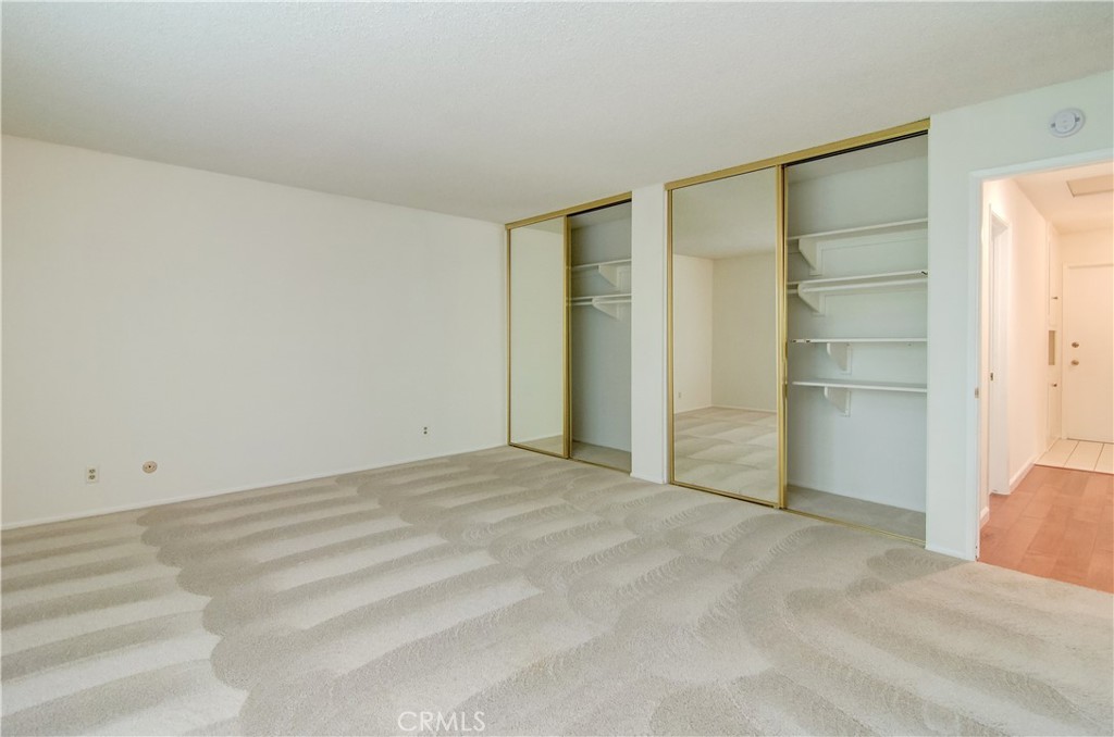 10091 Saltair Drive Cypress, CA 90630 - Photo 25 of 42 a view of an empty room with closet and a window