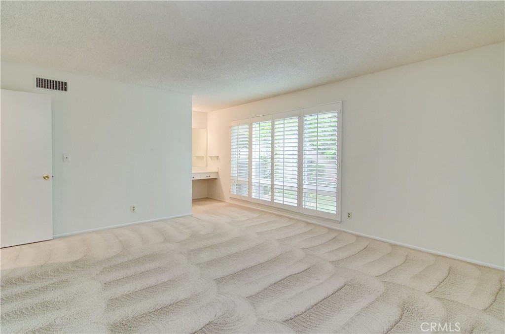 10091 Saltair Drive Cypress, CA 90630 - Photo 26 of 42 a view of an empty room with a window