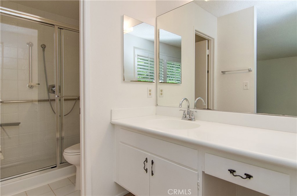 10091 Saltair Drive Cypress, CA 90630 - Photo 27 of 42 a bathroom with a sink and a mirror