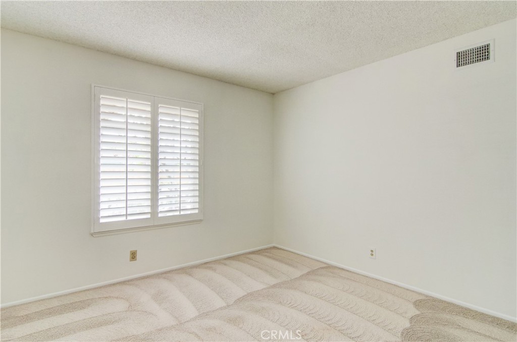10091 Saltair Drive Cypress, CA 90630 - Photo 31 of 42 an empty room with a window