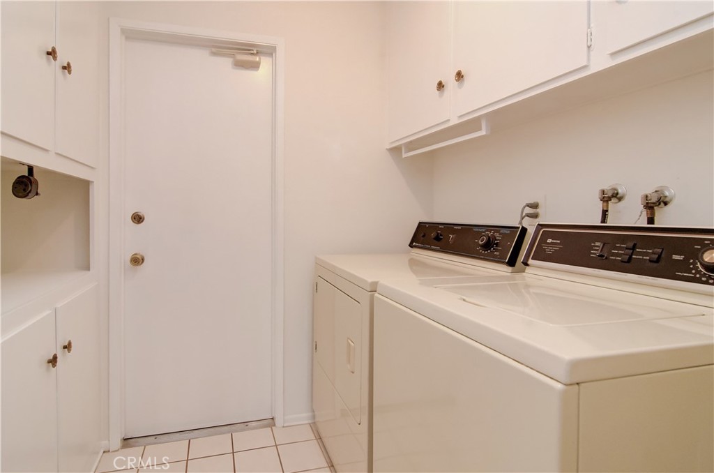 10091 Saltair Drive Cypress, CA 90630 - Photo 33 of 42 a utility room with dryer and washer