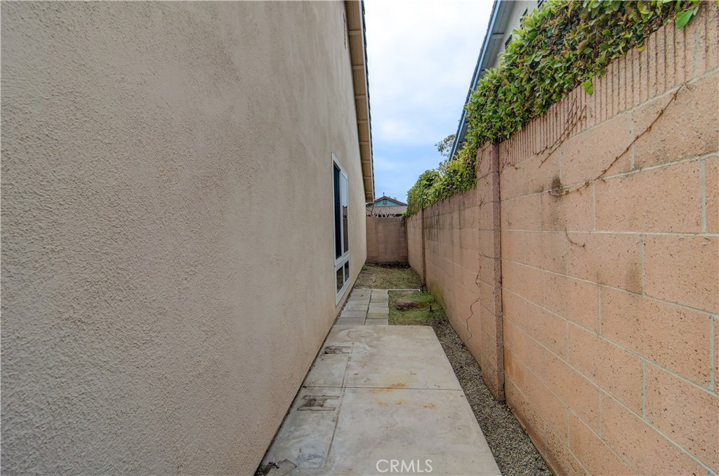 10091 Saltair Drive Cypress, CA 90630 - Photo 41 of 42 a view of a pathway both side of house