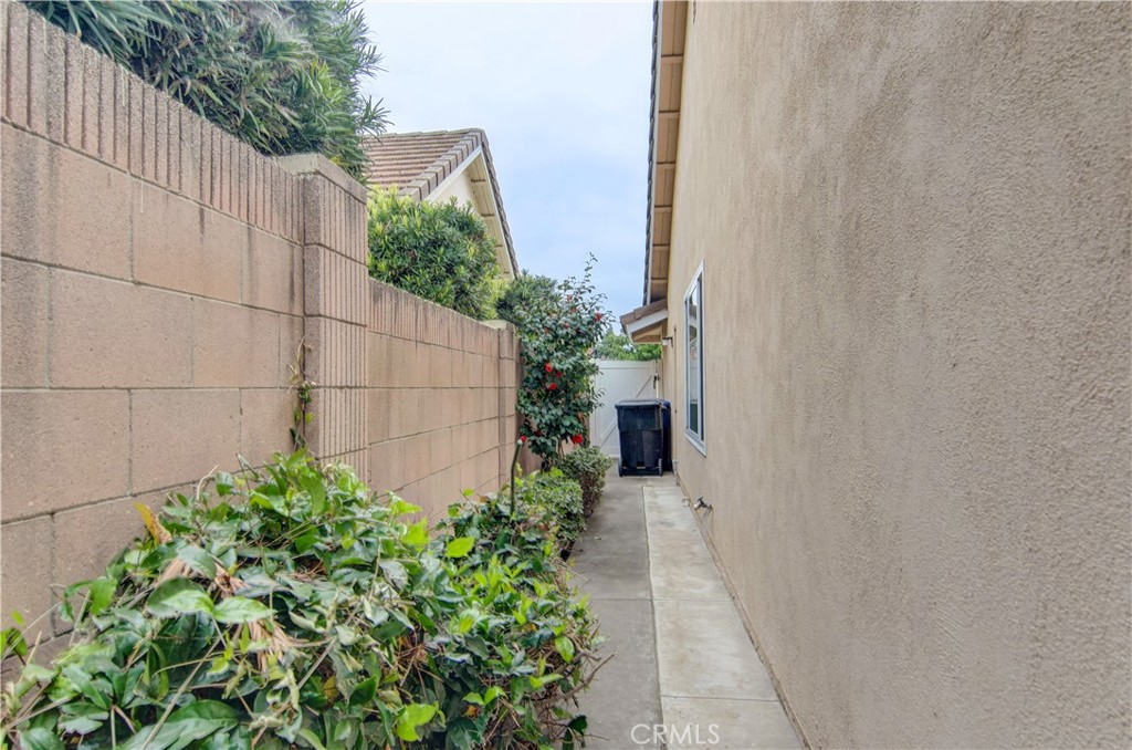 10091 Saltair Drive Cypress, CA 90630 - Photo 42 of 42 a backyard with potted plants and wooden fence