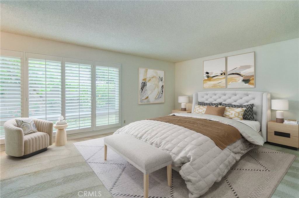 10091 Saltair Drive Cypress, CA 90630 - Photo 5 of 42 a bedroom with a bed and glass window