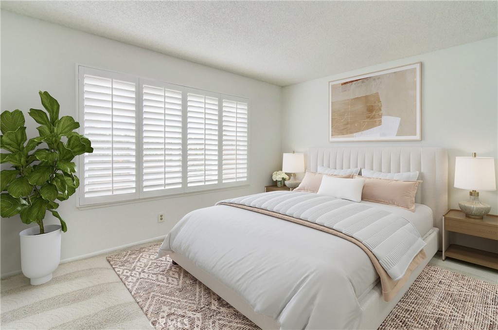 10091 Saltair Drive Cypress, CA 90630 - Photo 6 of 42 a bedroom with bed and a potted plant