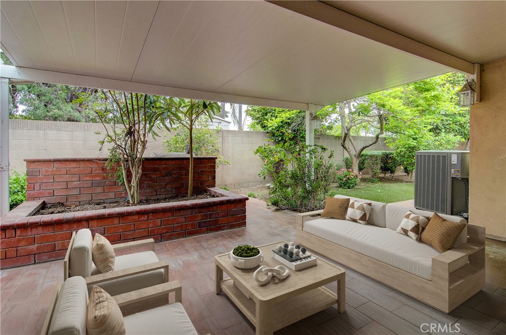 10091 Saltair Drive Cypress, CA 90630 - Photo 7 of 42 a living room with furniture and a large window