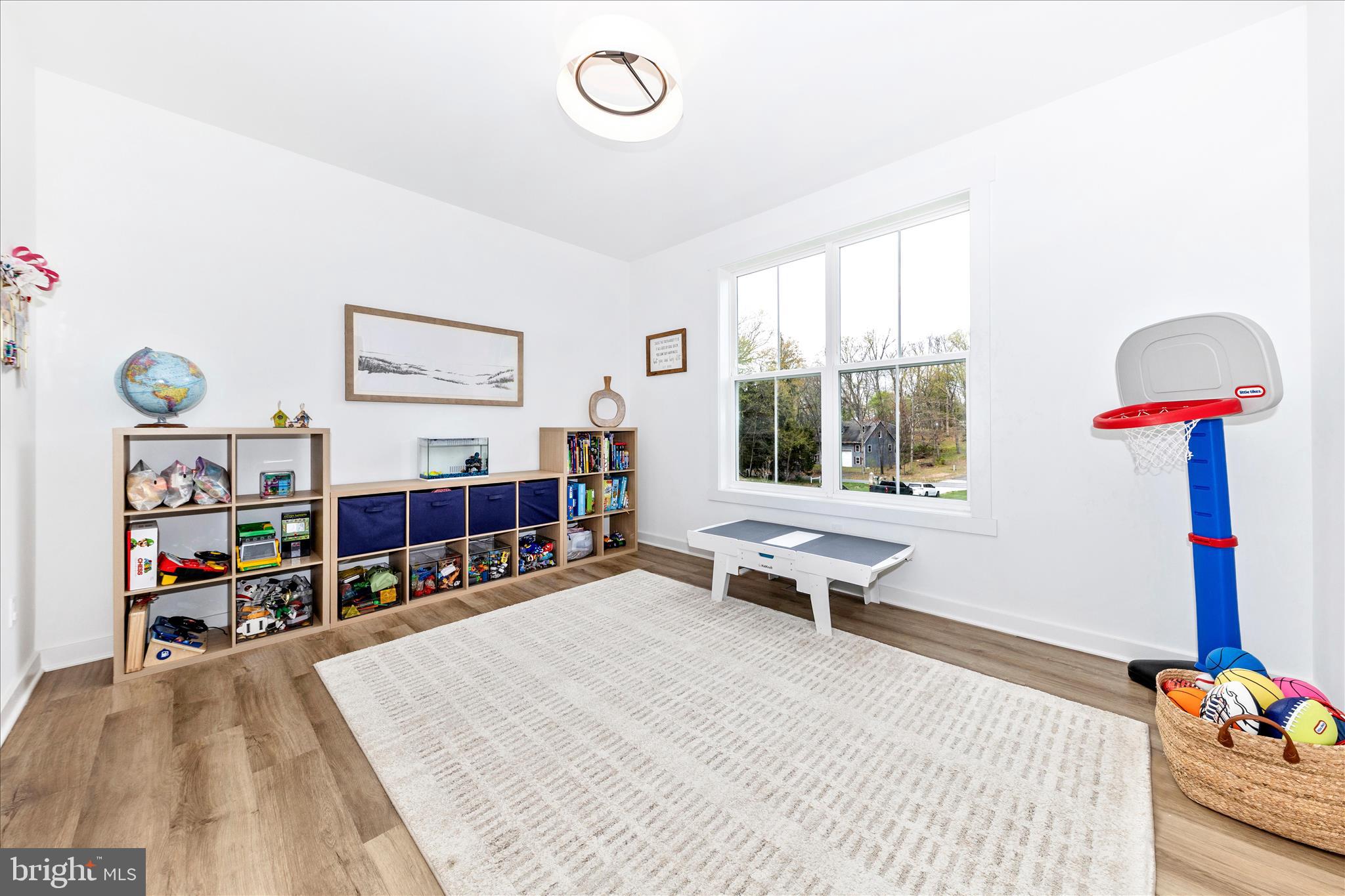 14105 Peddicord Road Mount Airy, MD 21771 - Photo 15 of 52 a living room with furniture a flat screen tv and a table