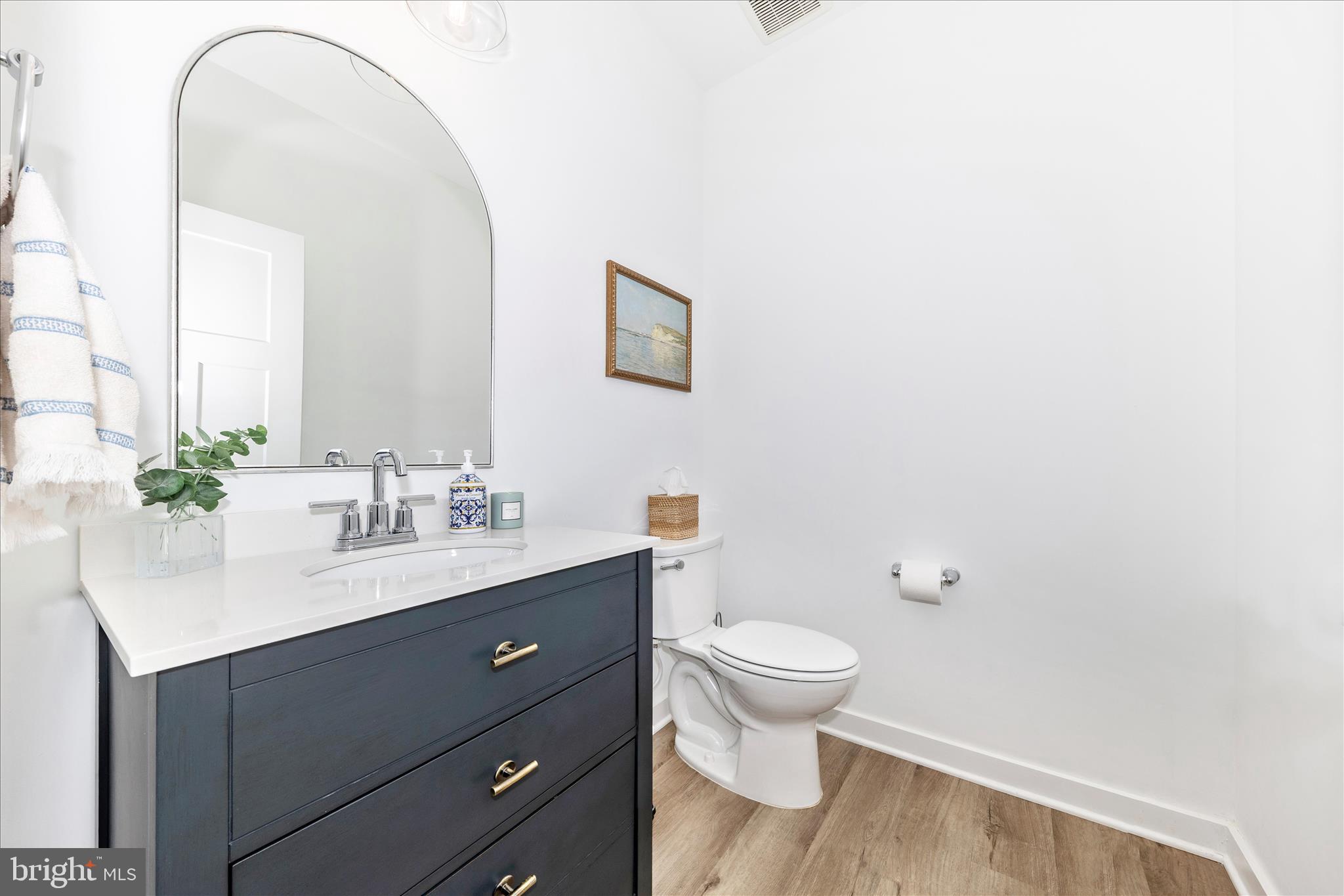 14105 Peddicord Road Mount Airy, MD 21771 - Photo 17 of 52 a bathroom with a sink a toilet and a mirror
