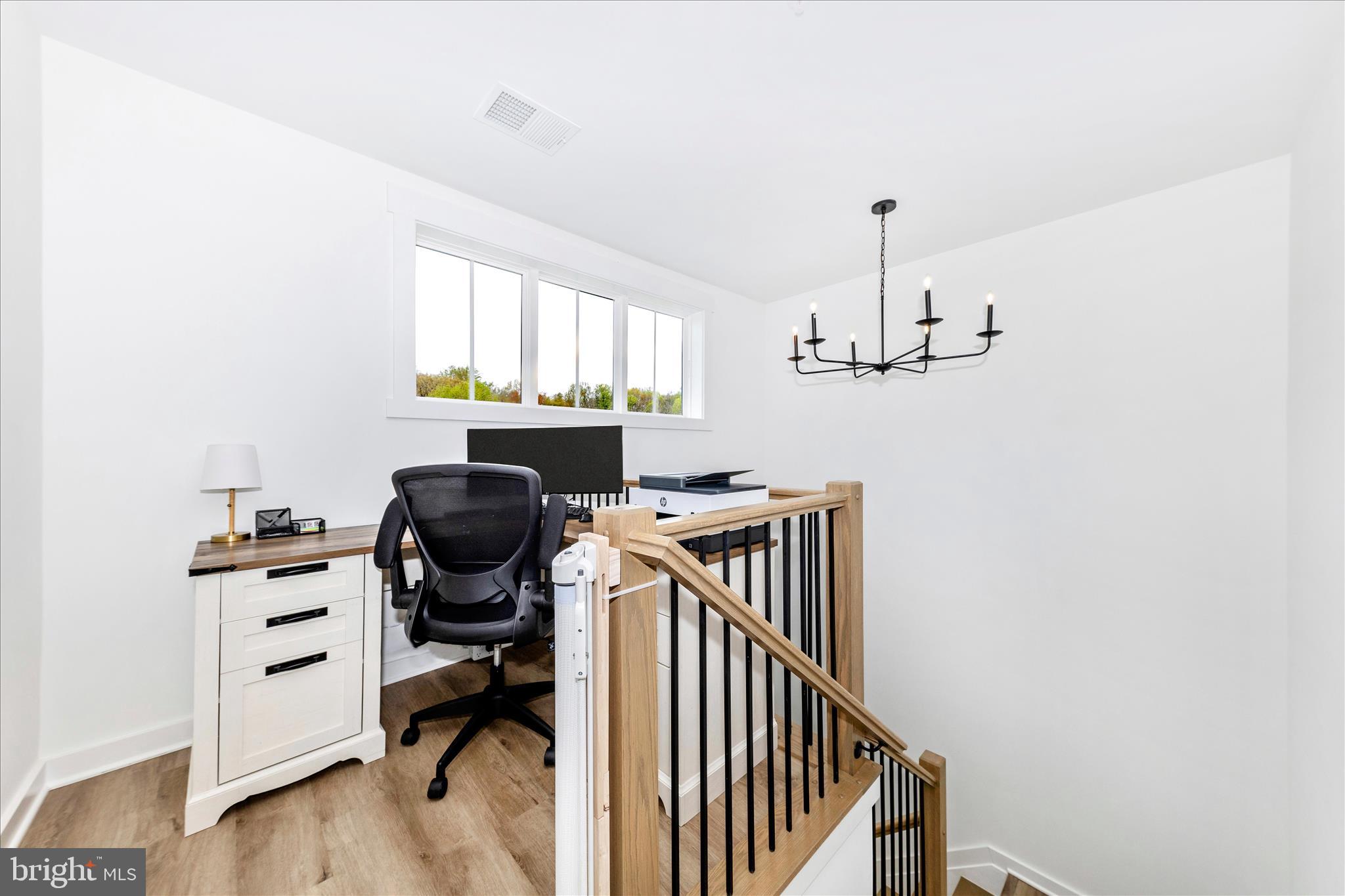 14105 Peddicord Road Mount Airy, MD 21771 - Photo 19 of 52 a view of a workspace with furniture and a window