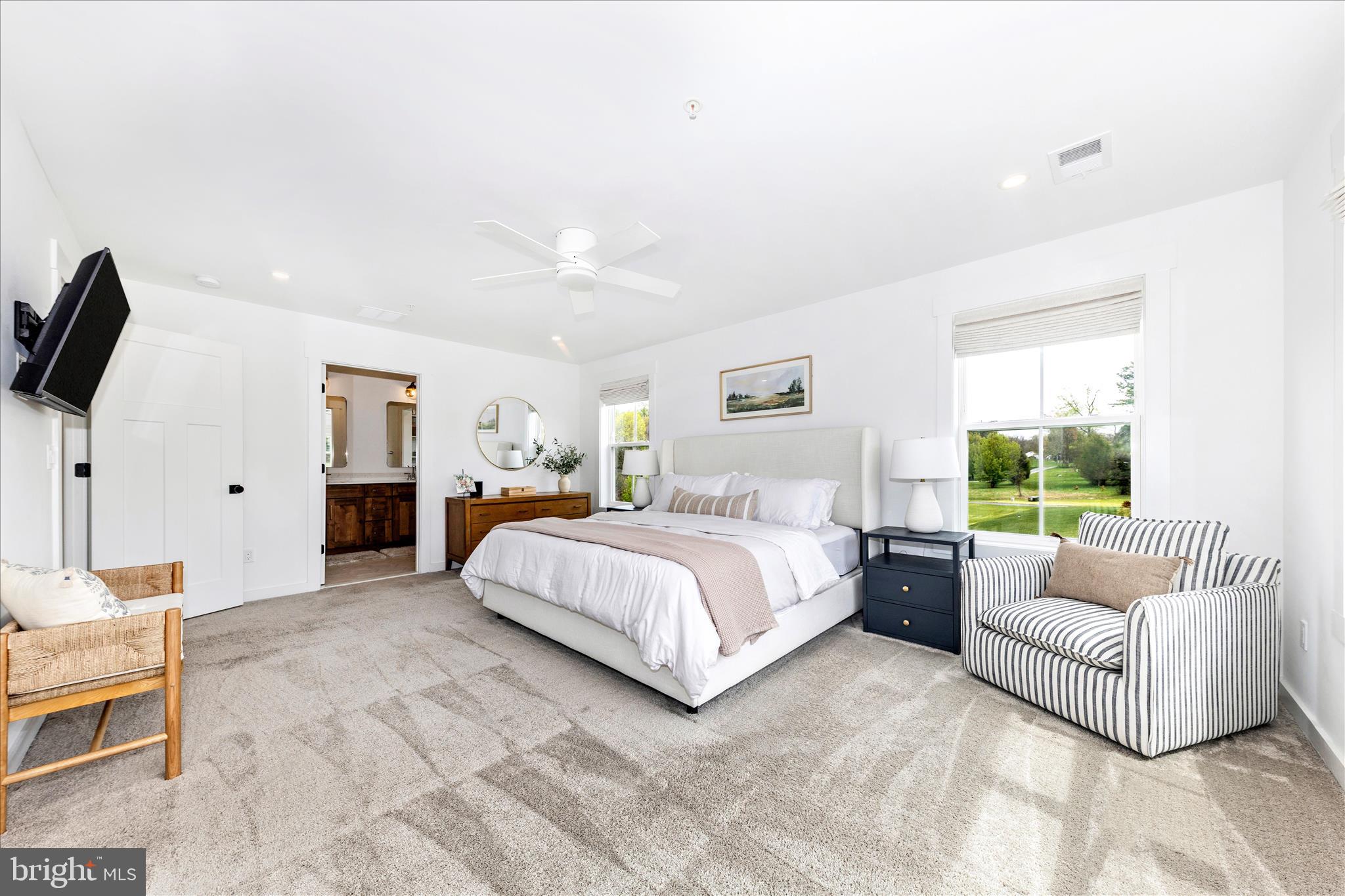 14105 Peddicord Road Mount Airy, MD 21771 - Photo 20 of 52 a spacious bedroom with a bed and a couch
