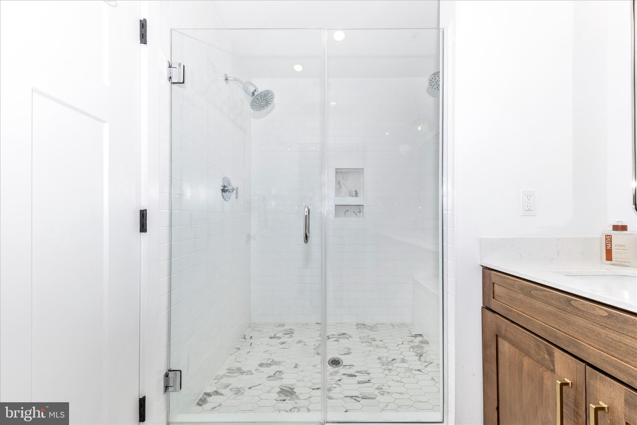 14105 Peddicord Road Mount Airy, MD 21771 - Photo 24 of 52 a bathroom with a shower and a sink