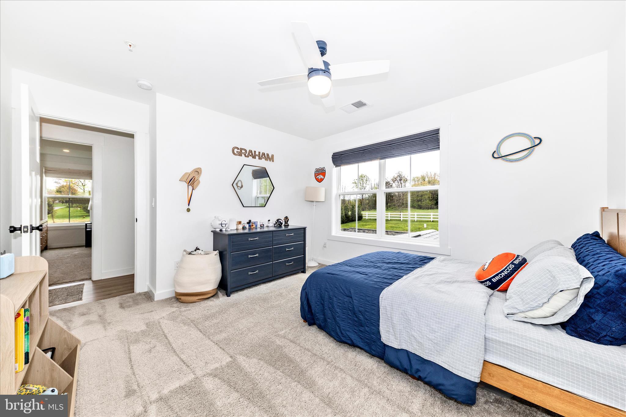14105 Peddicord Road Mount Airy, MD 21771 - Photo 25 of 52 a bedroom with a bed and a window