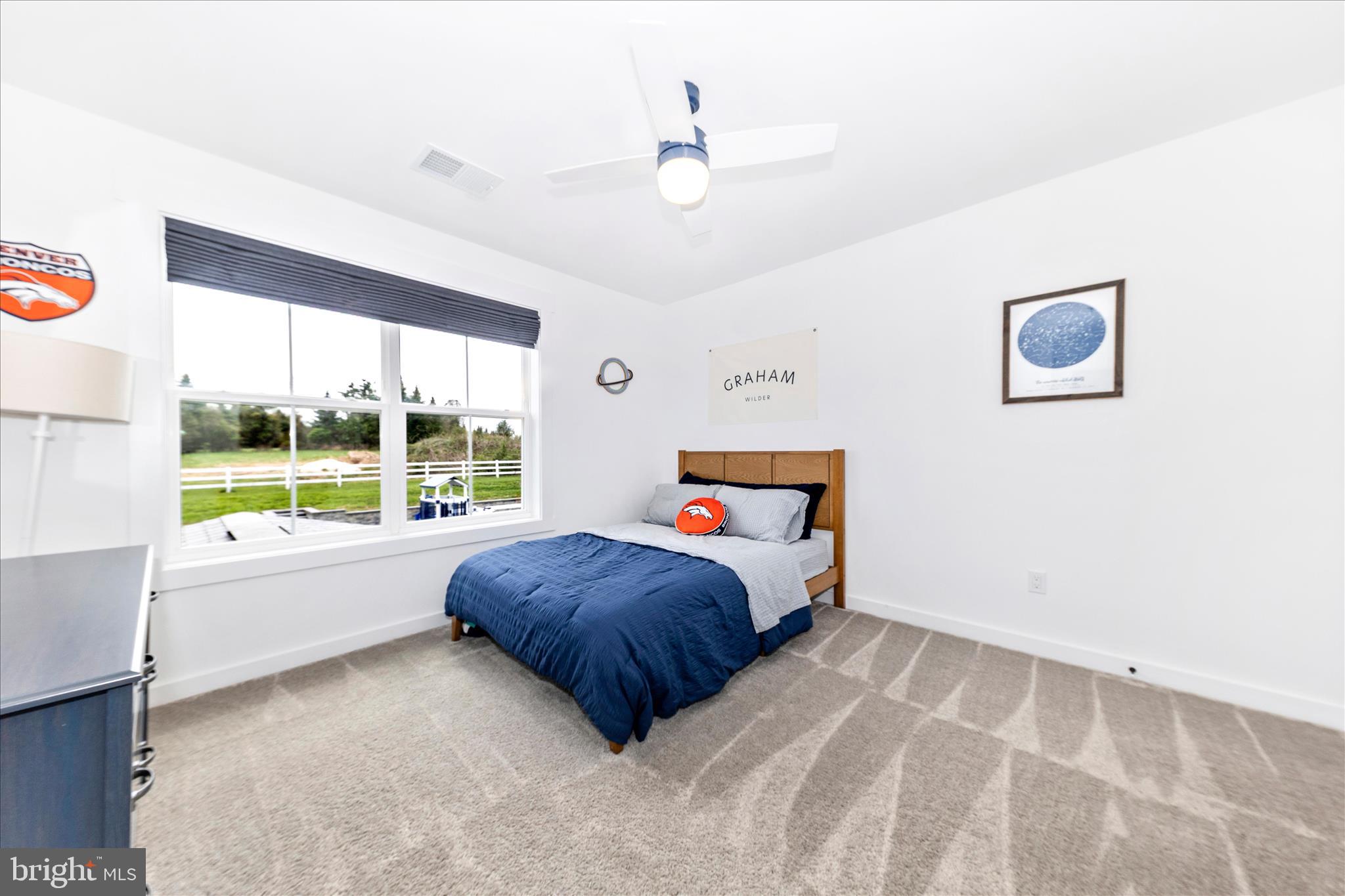 14105 Peddicord Road Mount Airy, MD 21771 - Photo 26 of 52 a bedroom with a bed and a large window