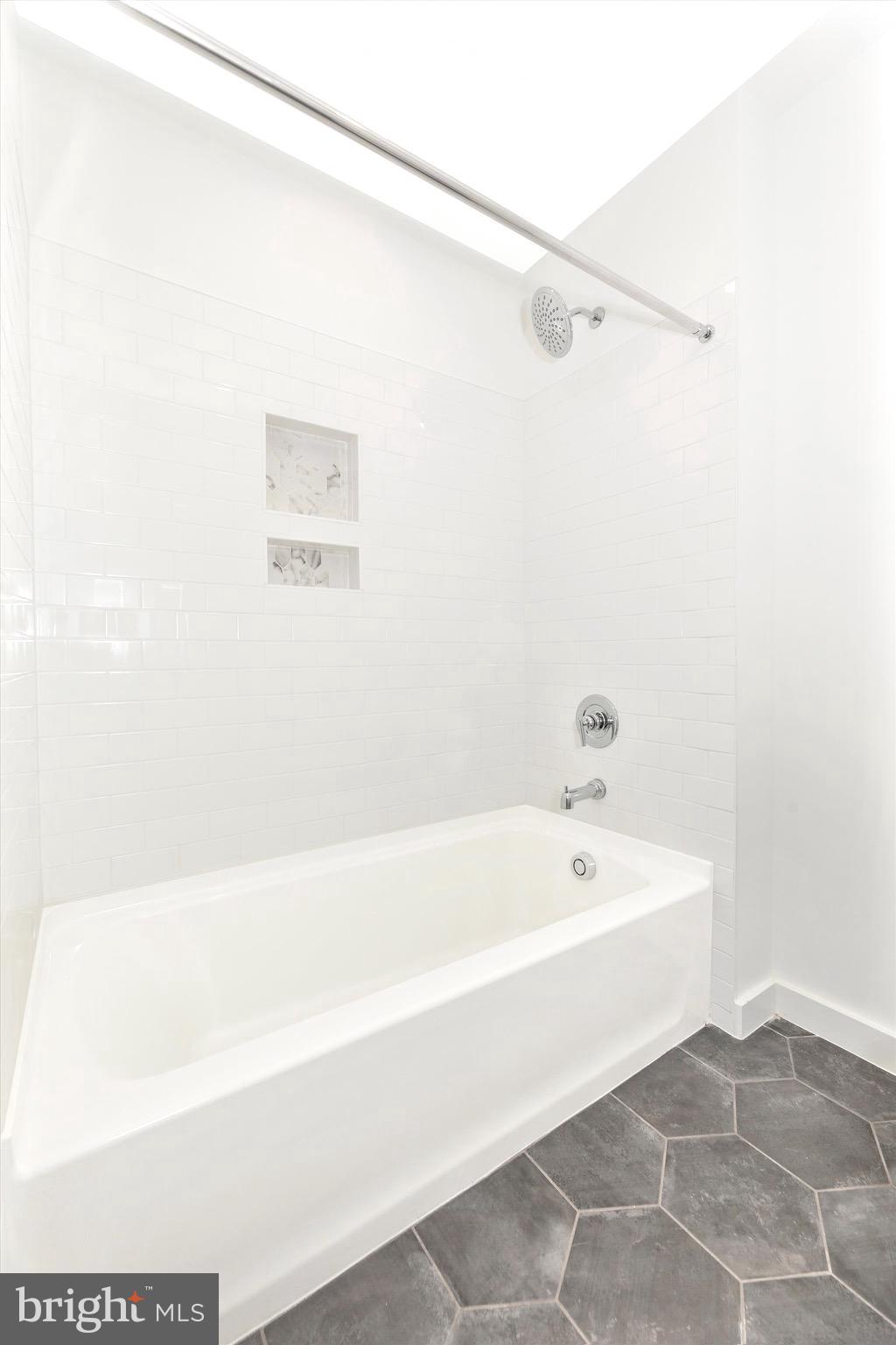14105 Peddicord Road Mount Airy, MD 21771 - Photo 28 of 52 a bathroom with a bathtub and a shower