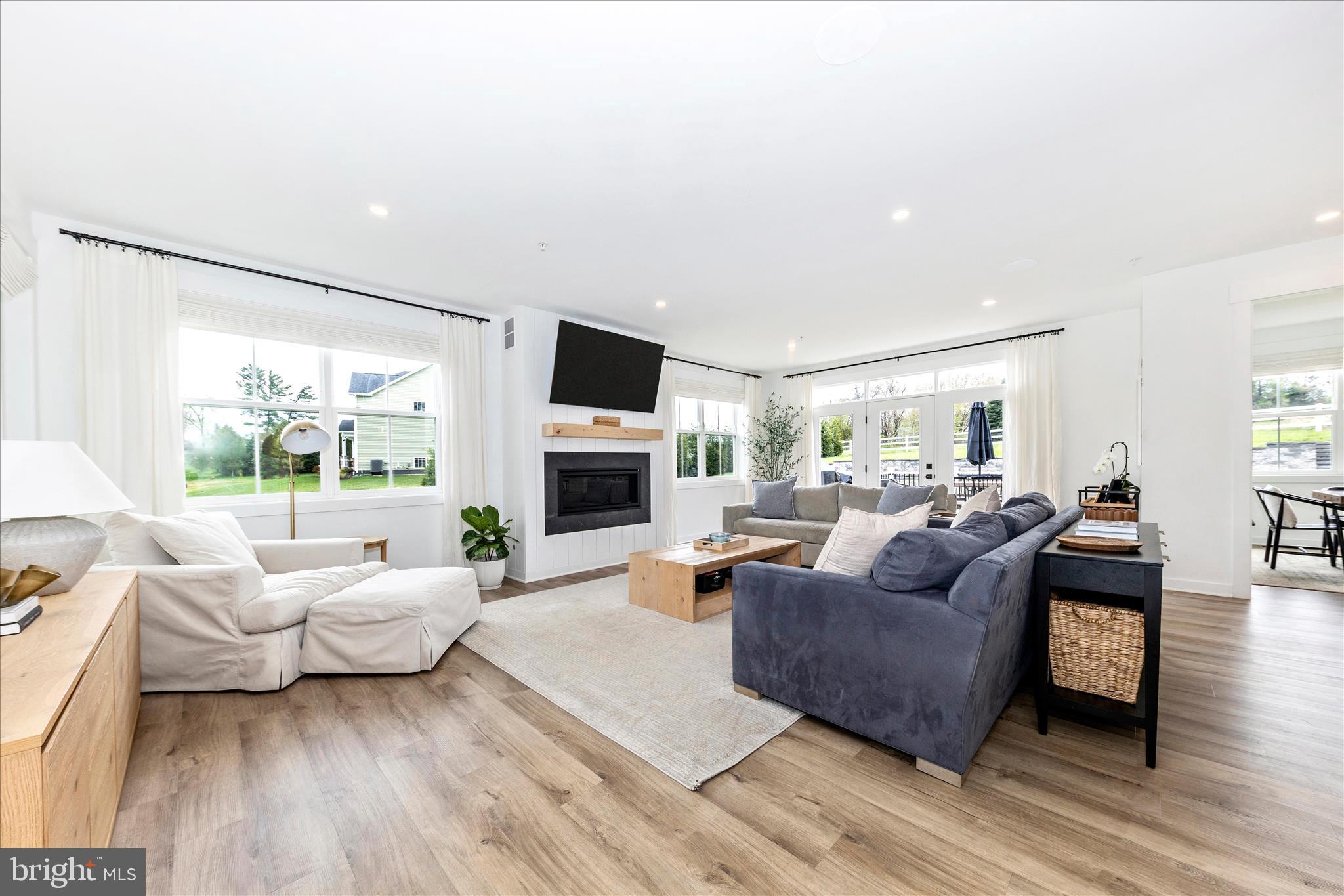 14105 Peddicord Road Mount Airy, MD 21771 - Photo 3 of 52 a living room with furniture fireplace and a large window