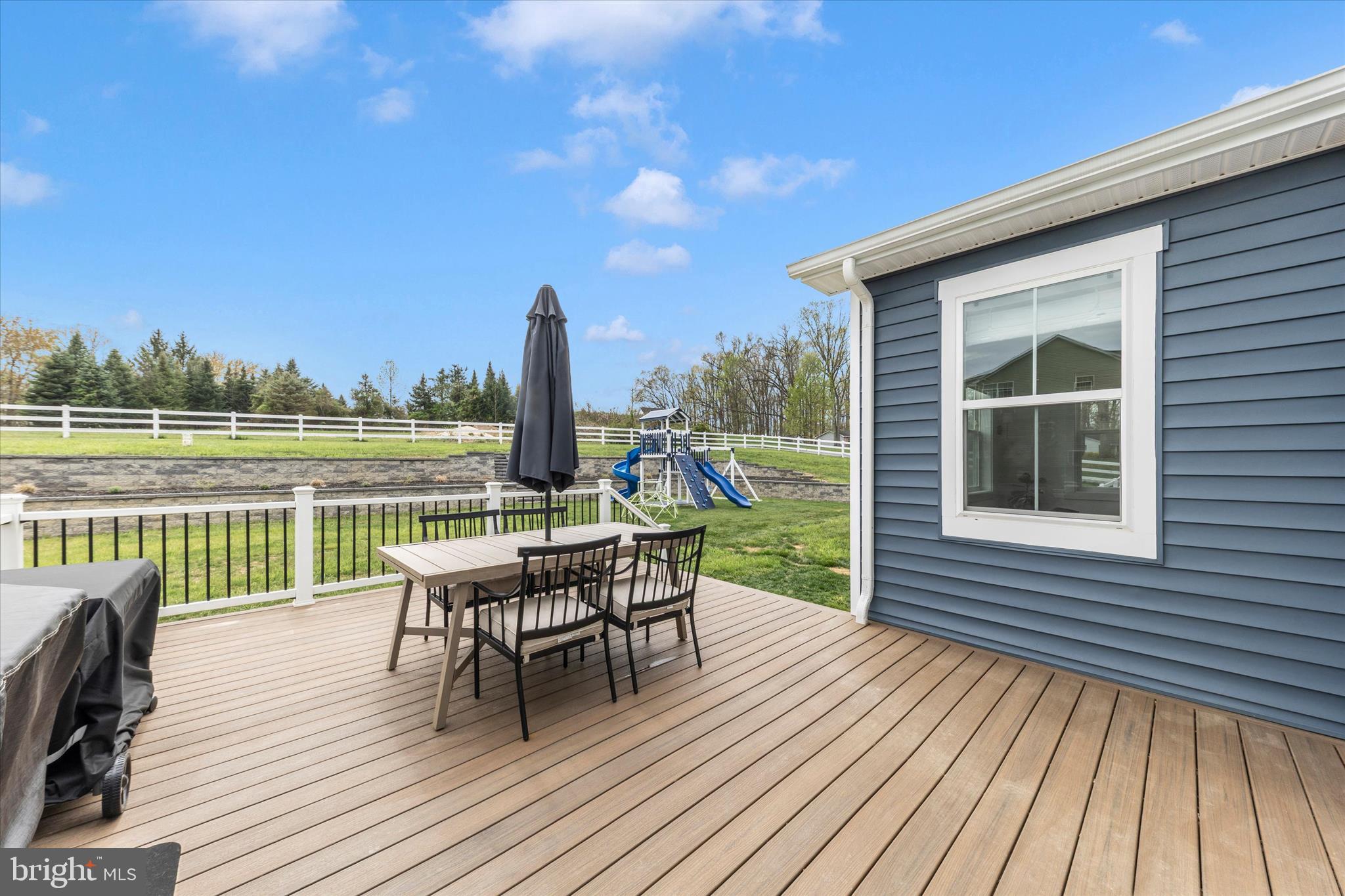 14105 Peddicord Road Mount Airy, MD 21771 - Photo 51 of 52 a view of a balcony with wooden floor and outdoor seating
