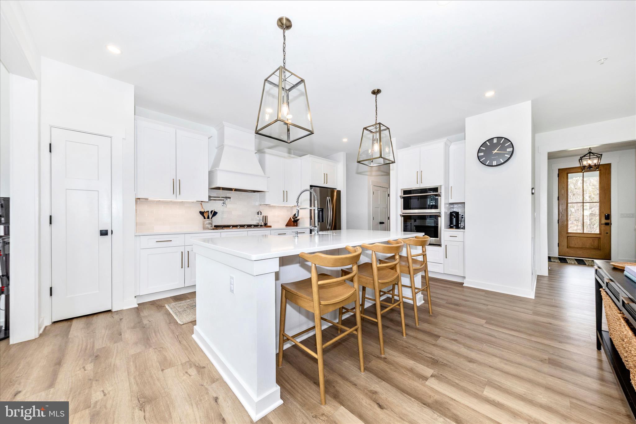 14105 Peddicord Road Mount Airy, MD 21771 - Photo 8 of 52 a kitchen with stainless steel appliances a dining table chairs stove and cabinets