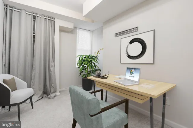 a dining room with furniture and a potted plant