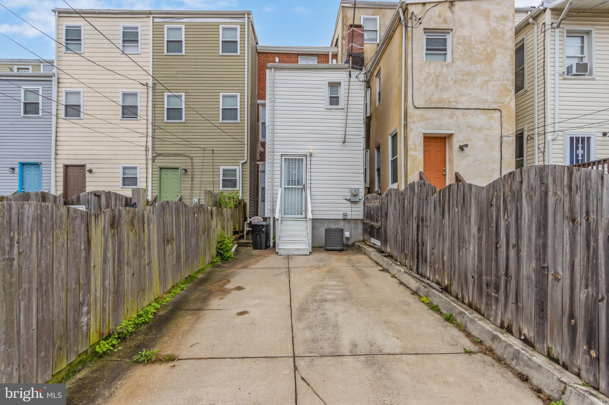 1235 North Bond Street Baltimore, MD 21213 - Photo 16 of 20 a view of a street with wooden fence