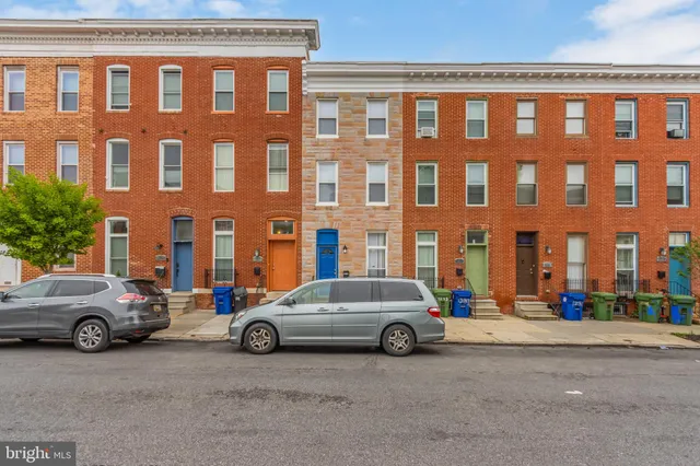 a view of a double car parked in front of a building