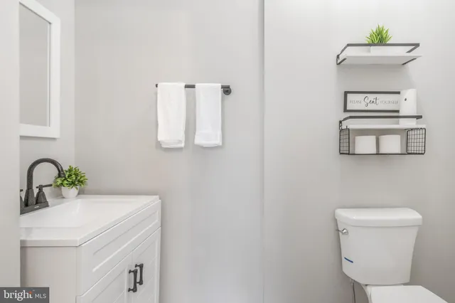 a bathroom with a sink toilet and