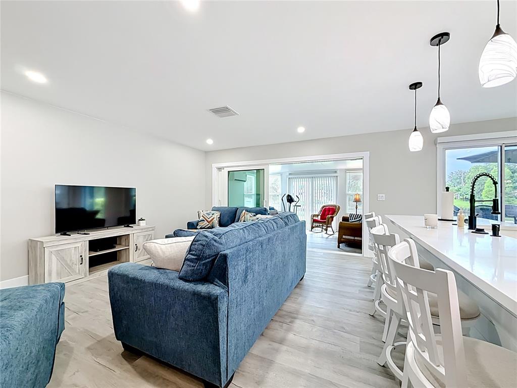 508 Shore Drive Largo, FL 33771 - Photo 6 of 31 a living room with furniture and a flat screen tv