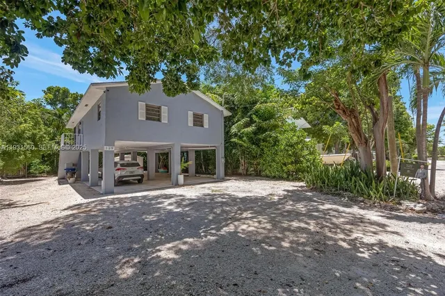 a house with trees in front of it