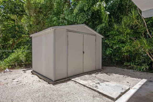 a backyard of a house with trees