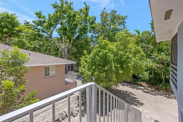 a balcony view with an outdoor space