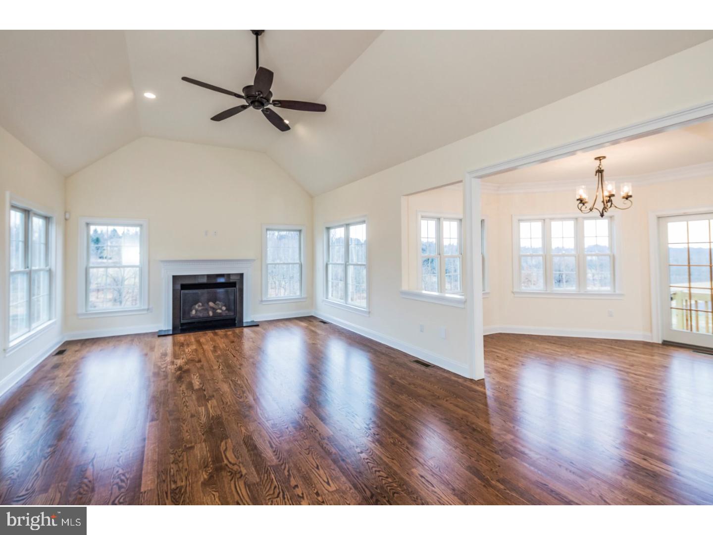 14 Partridge Road Flemington, NJ 08822 - Photo 14 of 24 a view of an empty room with wooden floor and a fireplace
