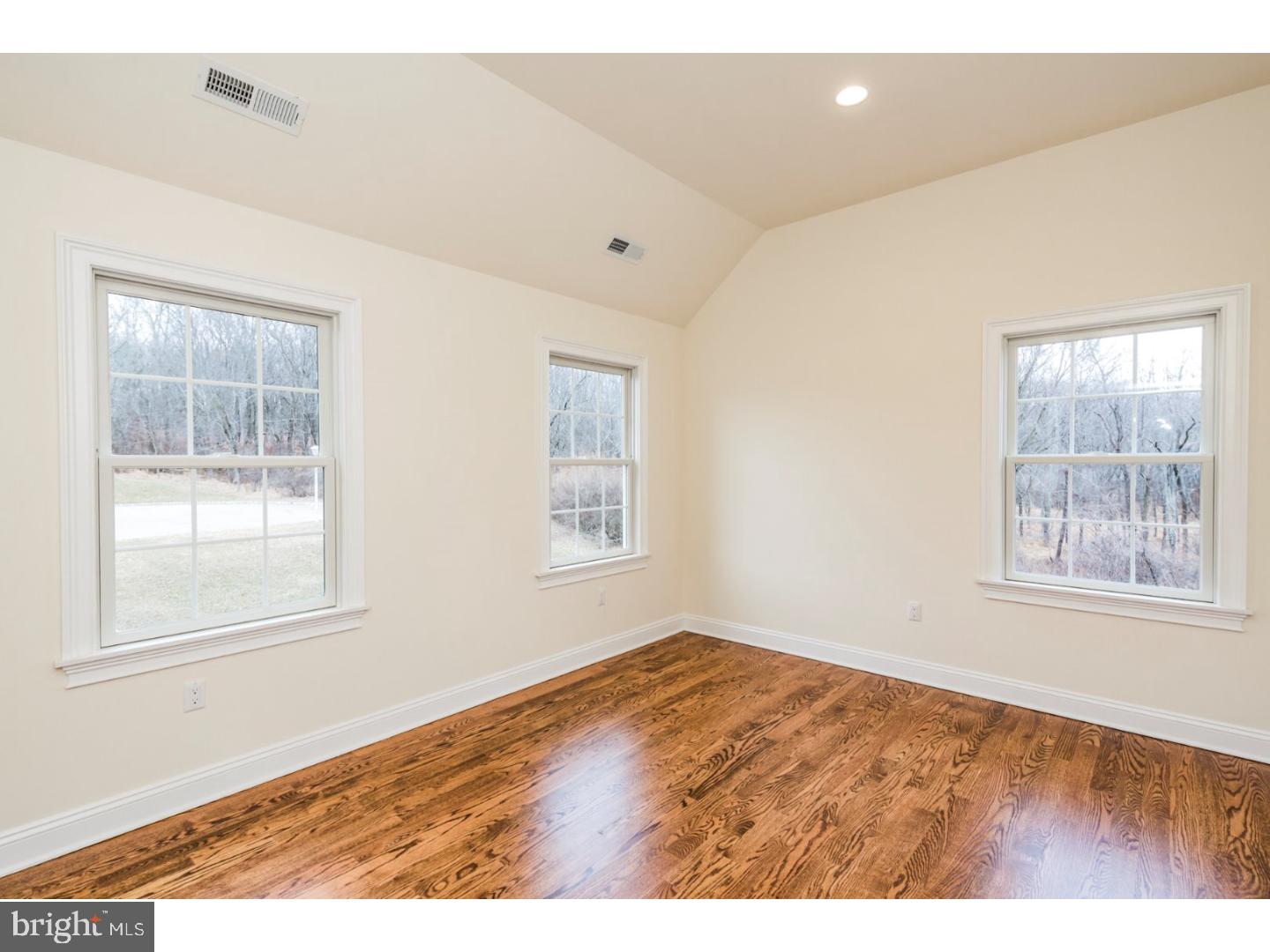 14 Partridge Road Flemington, NJ 08822 - Photo 22 of 24 an empty room with wooden floor and windows