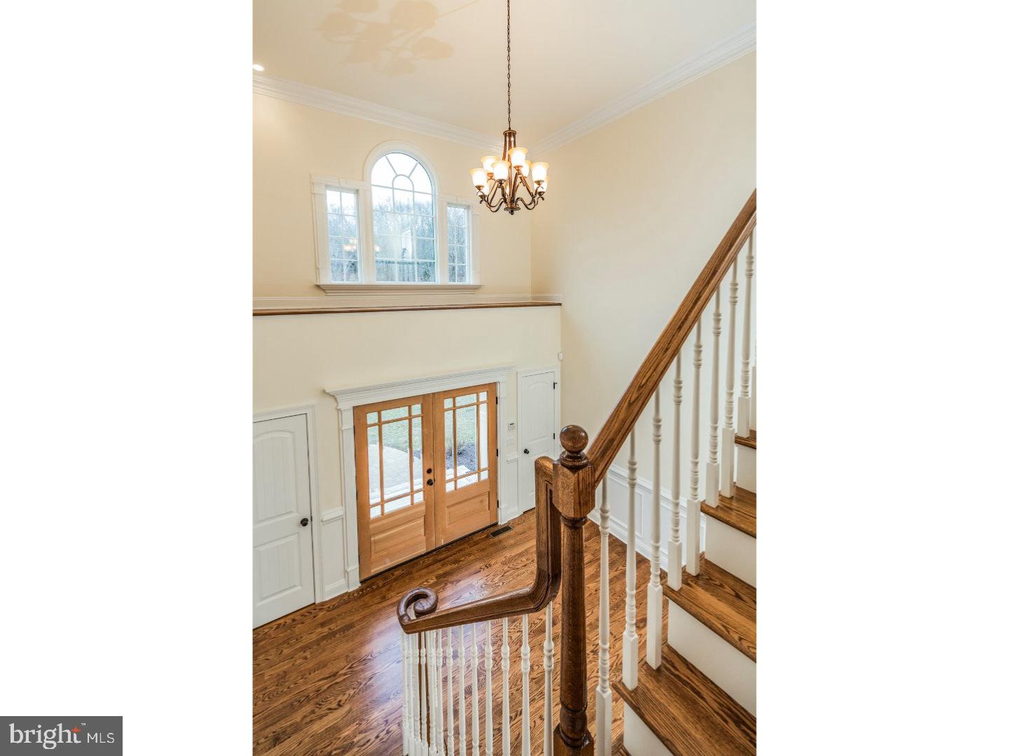 14 Partridge Road Flemington, NJ 08822 - Photo 5 of 24 a view of a hallway with couches and chandelier