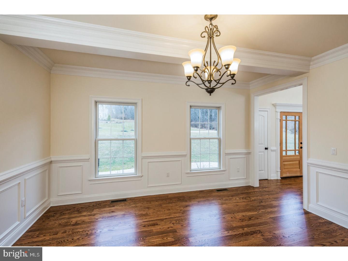 14 Partridge Road Flemington, NJ 08822 - Photo 7 of 24 a view of an empty room with wooden floor and a window