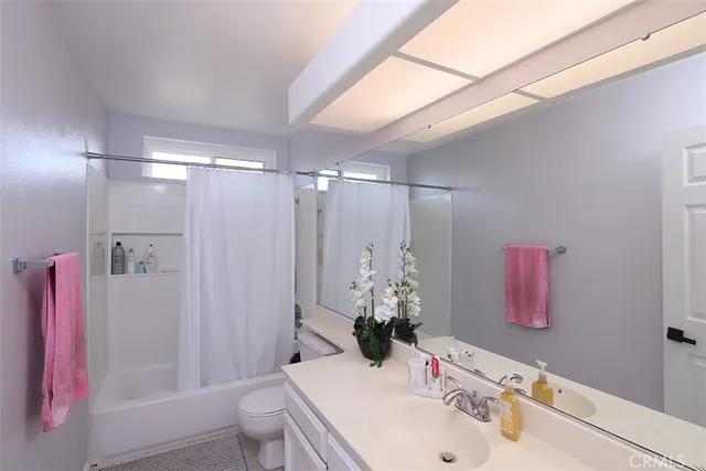 a bed room with a bed window and a chair