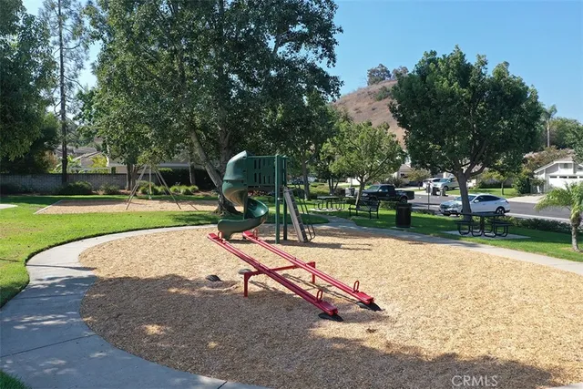 a view of a golf course with trees