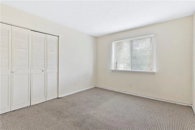 an empty room with a empty space and window