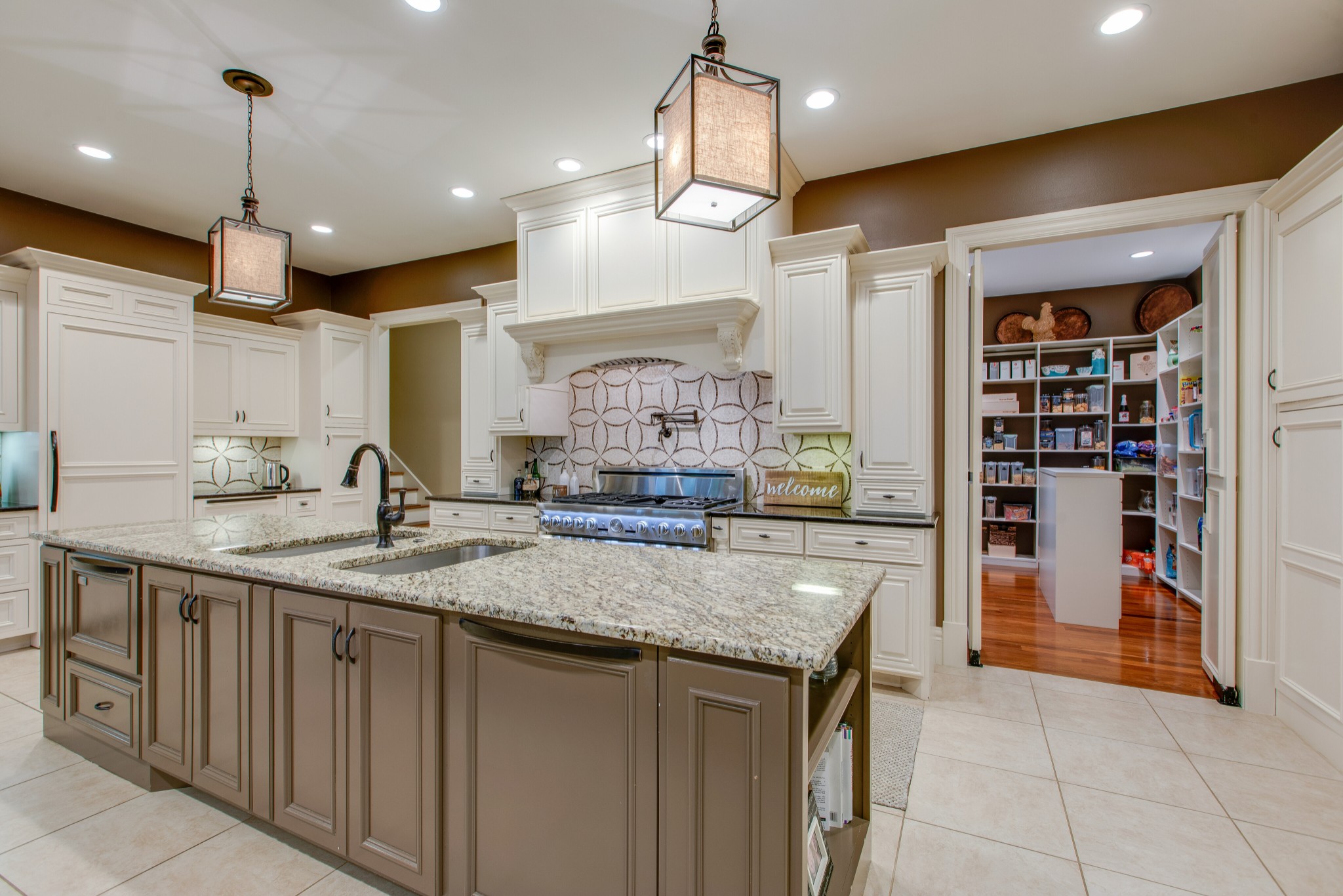 4200 Two Rivers Lane Franklin, TN 37069 - Photo 13 of 44 a kitchen with stainless steel appliances granite countertop a sink a oven and a refrigerator