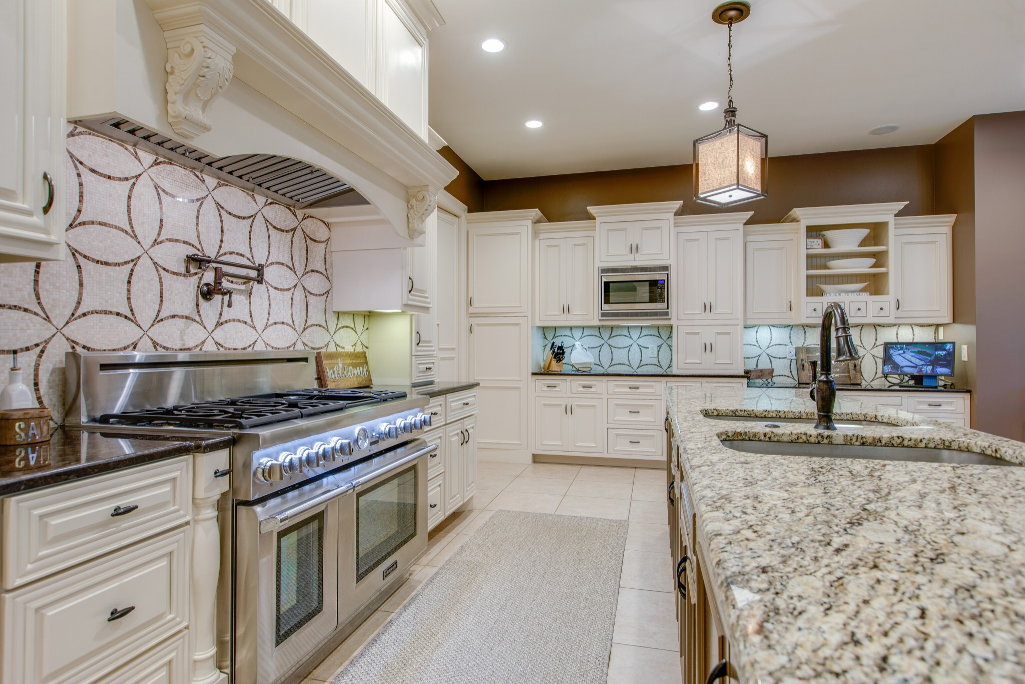 4200 Two Rivers Lane Franklin, TN 37069 - Photo 14 of 44 a kitchen with stainless steel appliances granite countertop a sink a stove and a wooden floors
